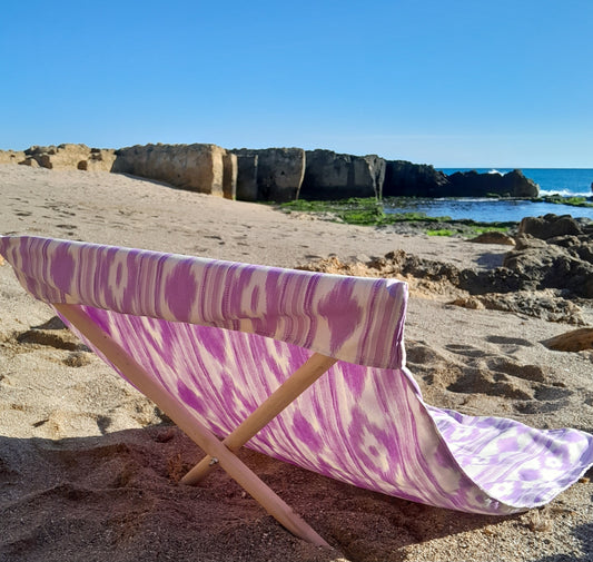 Lona tumbona artesanal para playa ikat lila hecha en Mallorca -