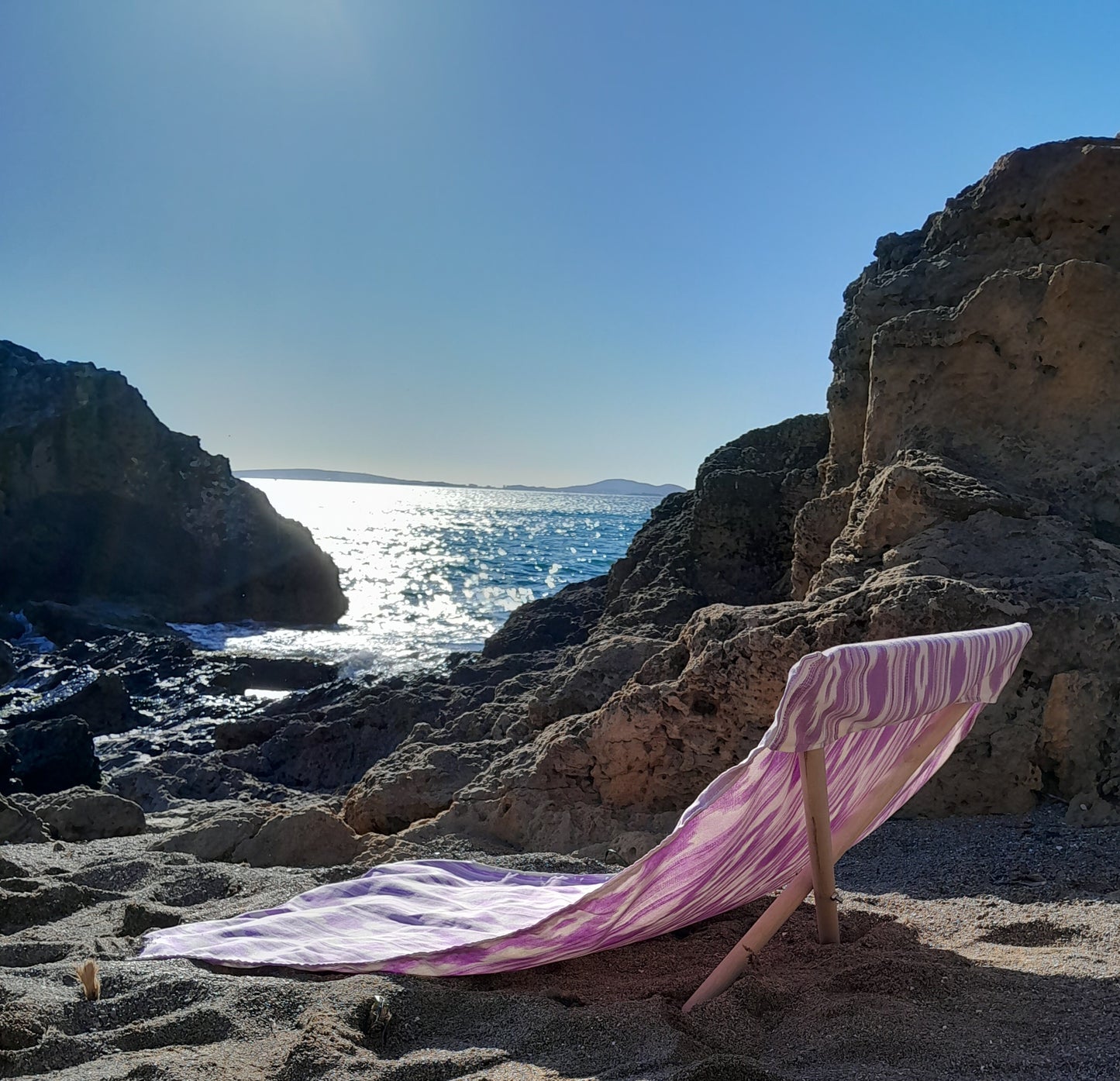Lona tumbona artesanal para playa ikat lila hecha en Mallorca -